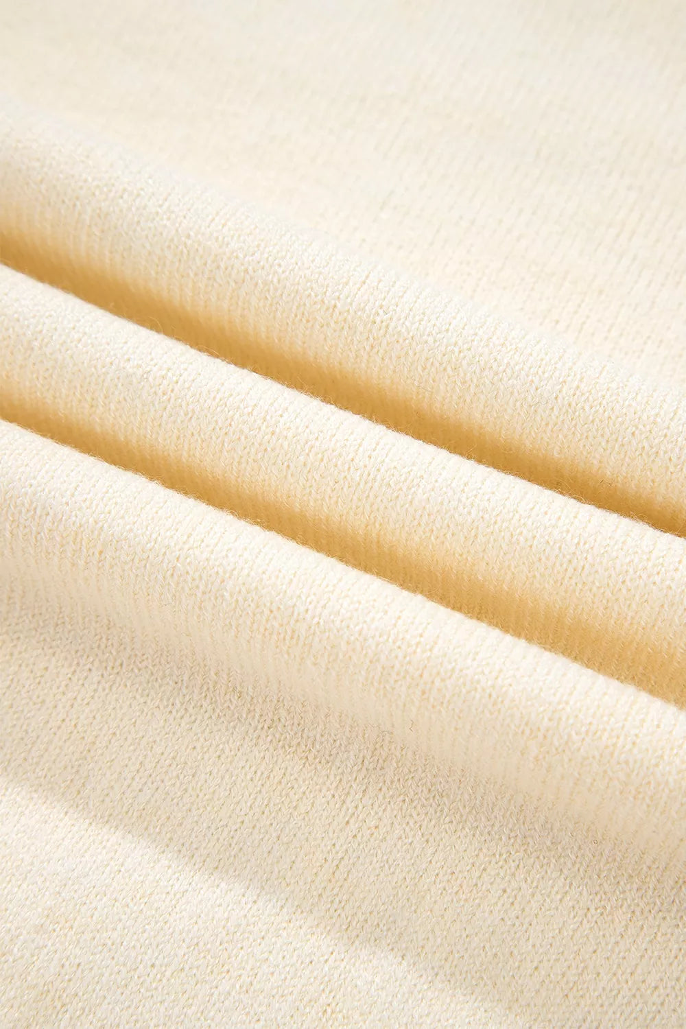 Button-cuff raglan sleeve crew neck sweater