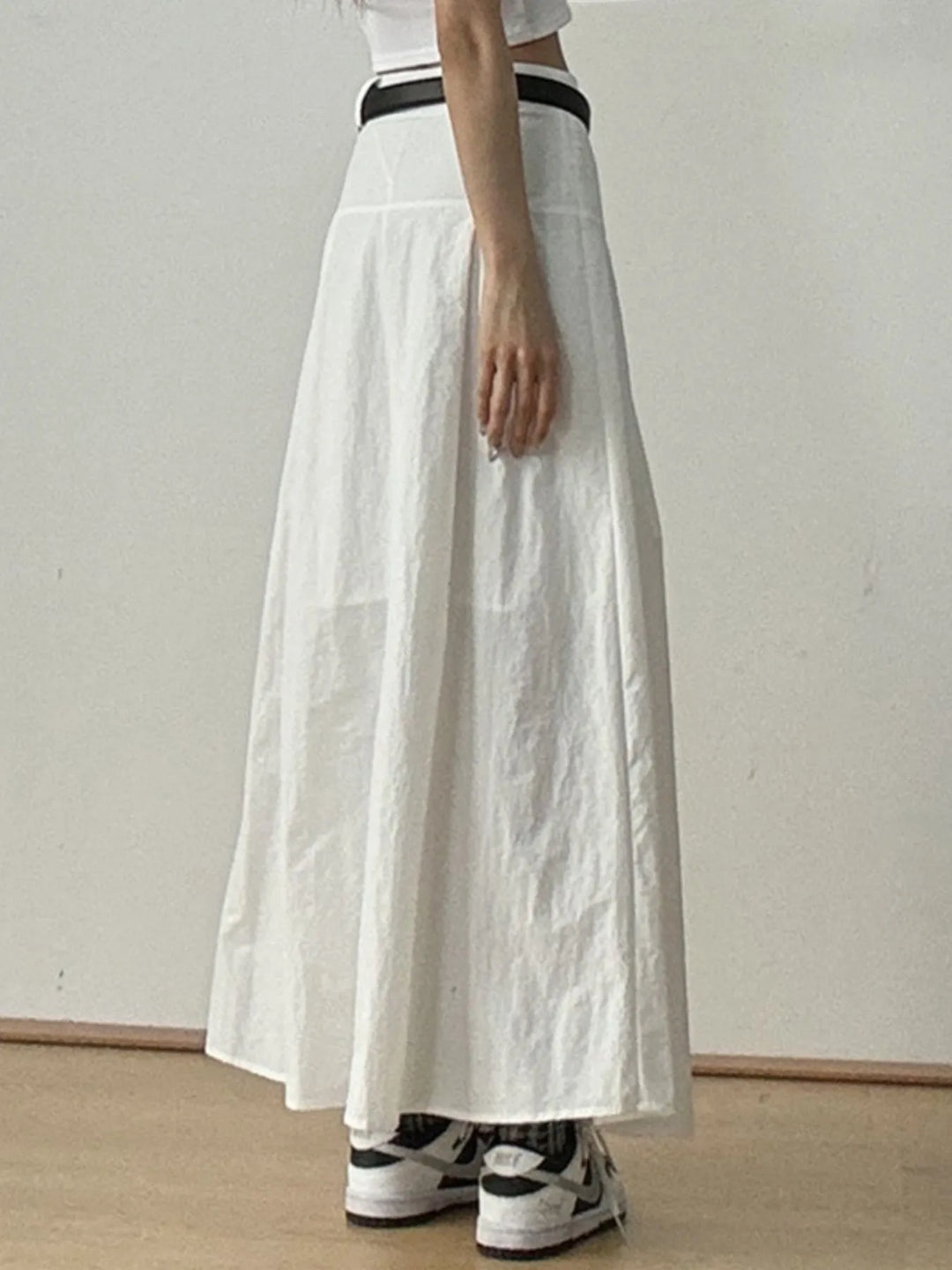 High-rise A-line maxi skirt with front pleats
