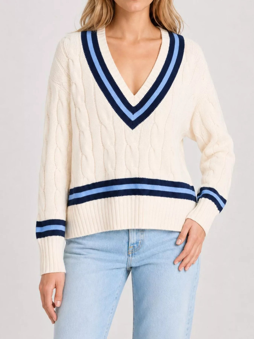 Cable knit v-neck cricket sweater with striped trim