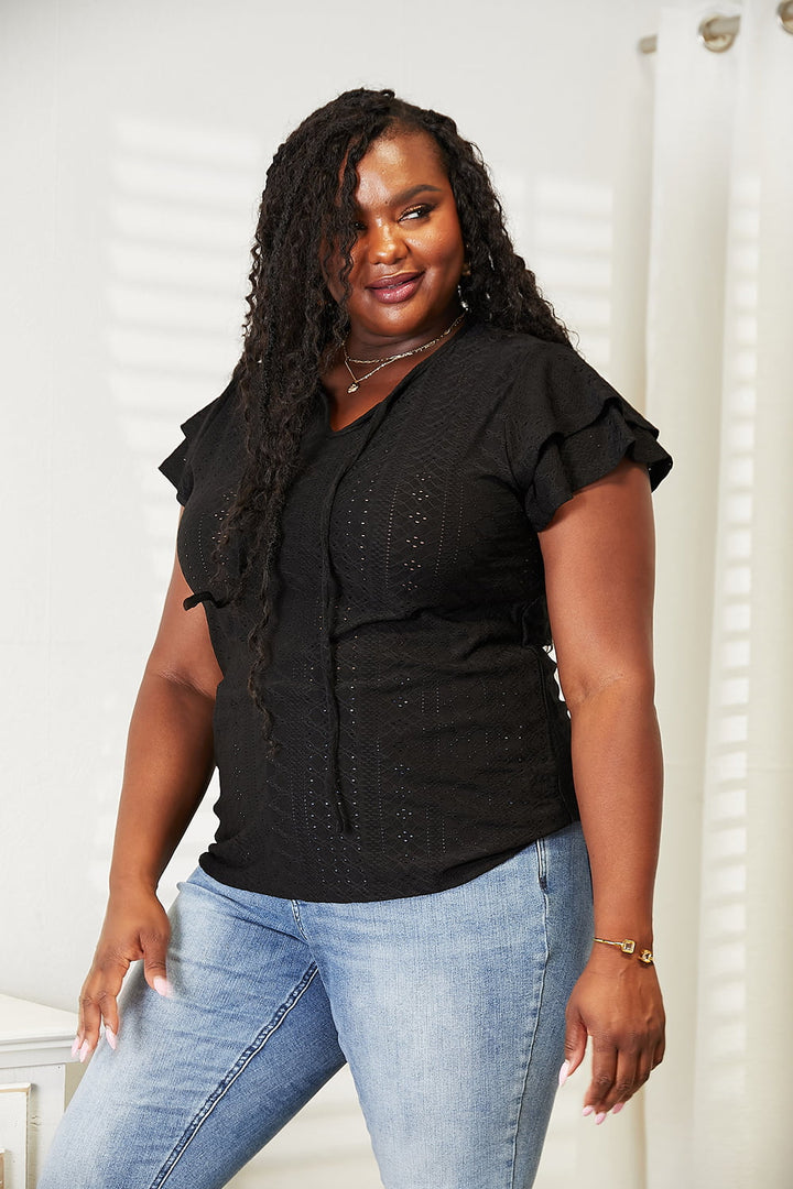Eyelet tie-neck blouse with tiered flutter sleeves