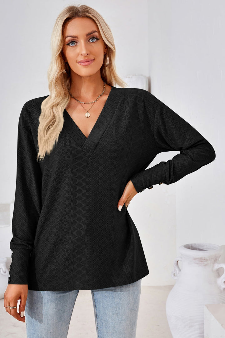 Textured knit V-neck long sleeve top with button cuffs