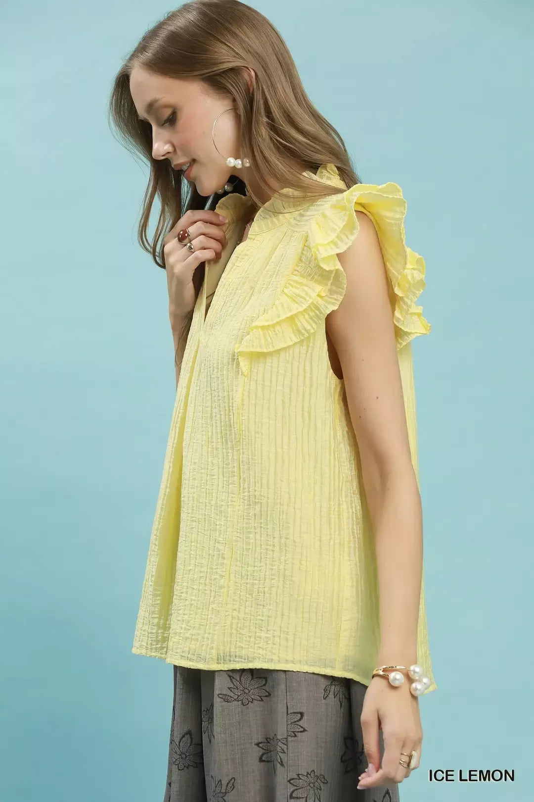 Textured split V-neck top with ruffle cap sleeves