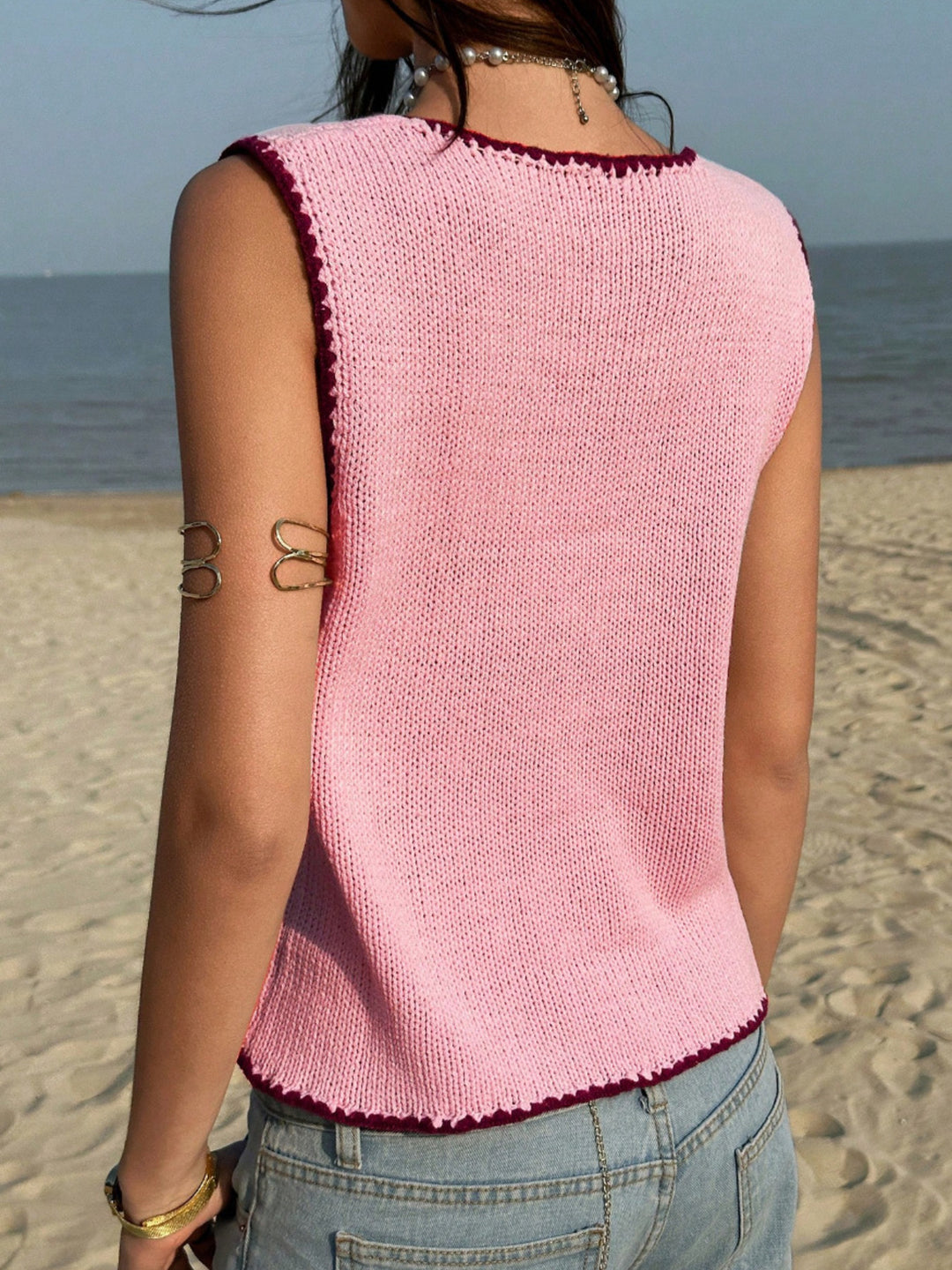 Button-front knit sweater vest with contrast whipstitch trim