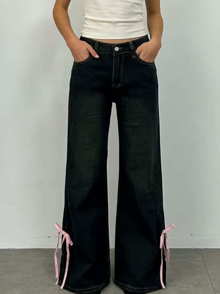 Low-rise flare jeans with ribbon bow leg slits