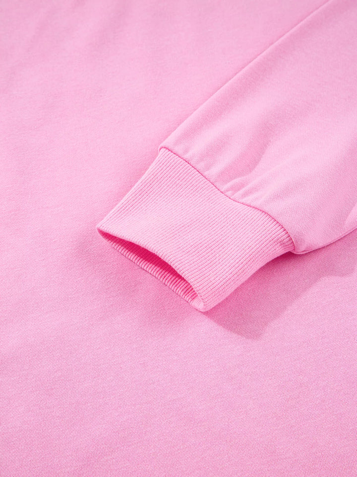 Oversized XOXO graphic sweatshirt with exposed seams and bows