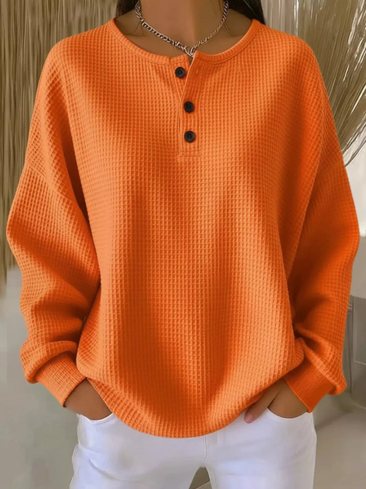Orange Waffle knit long sleeve henley top with button placket