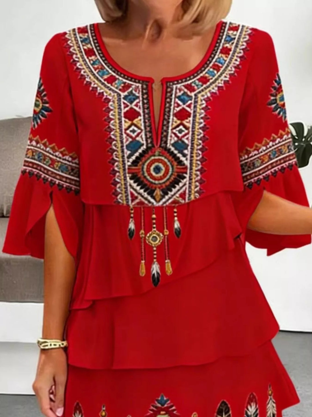 Tribal print tiered ruffle mini dress with notched neckline