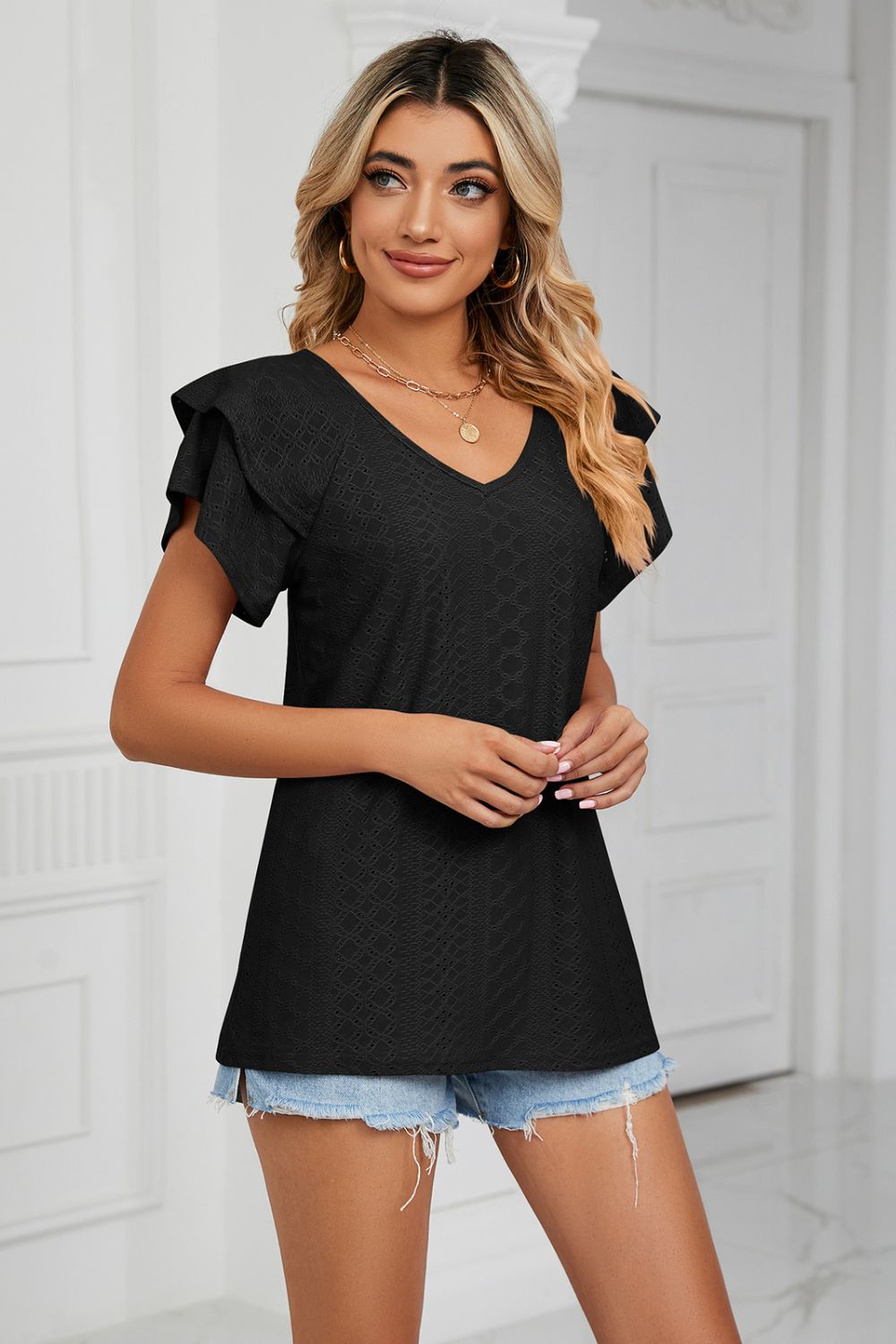 Eyelet knit V-neck top with layered flutter sleeves