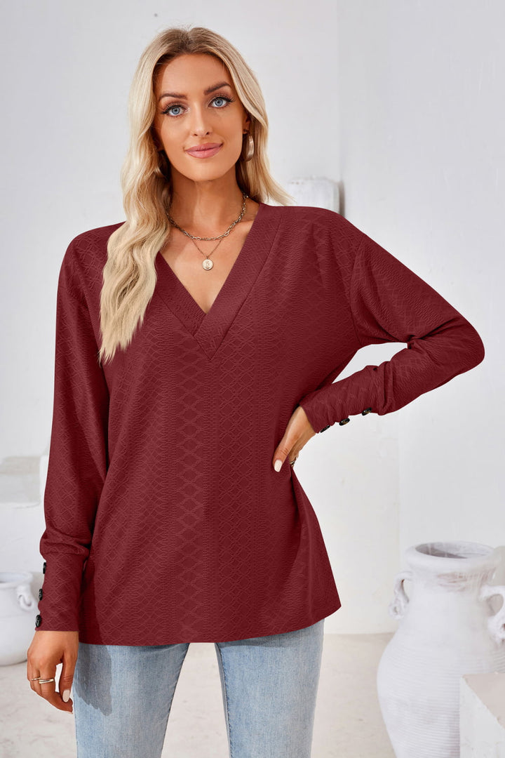 Textured knit V-neck long sleeve top with button cuffs