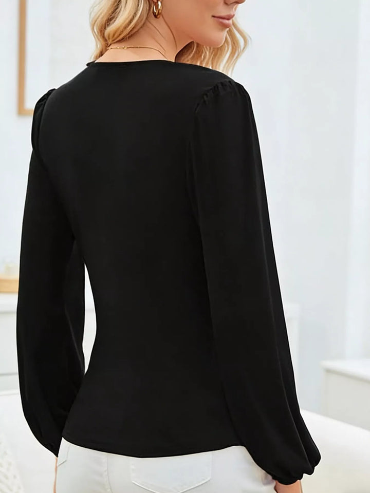 Long sleeve surplice V-neck ruched blouse