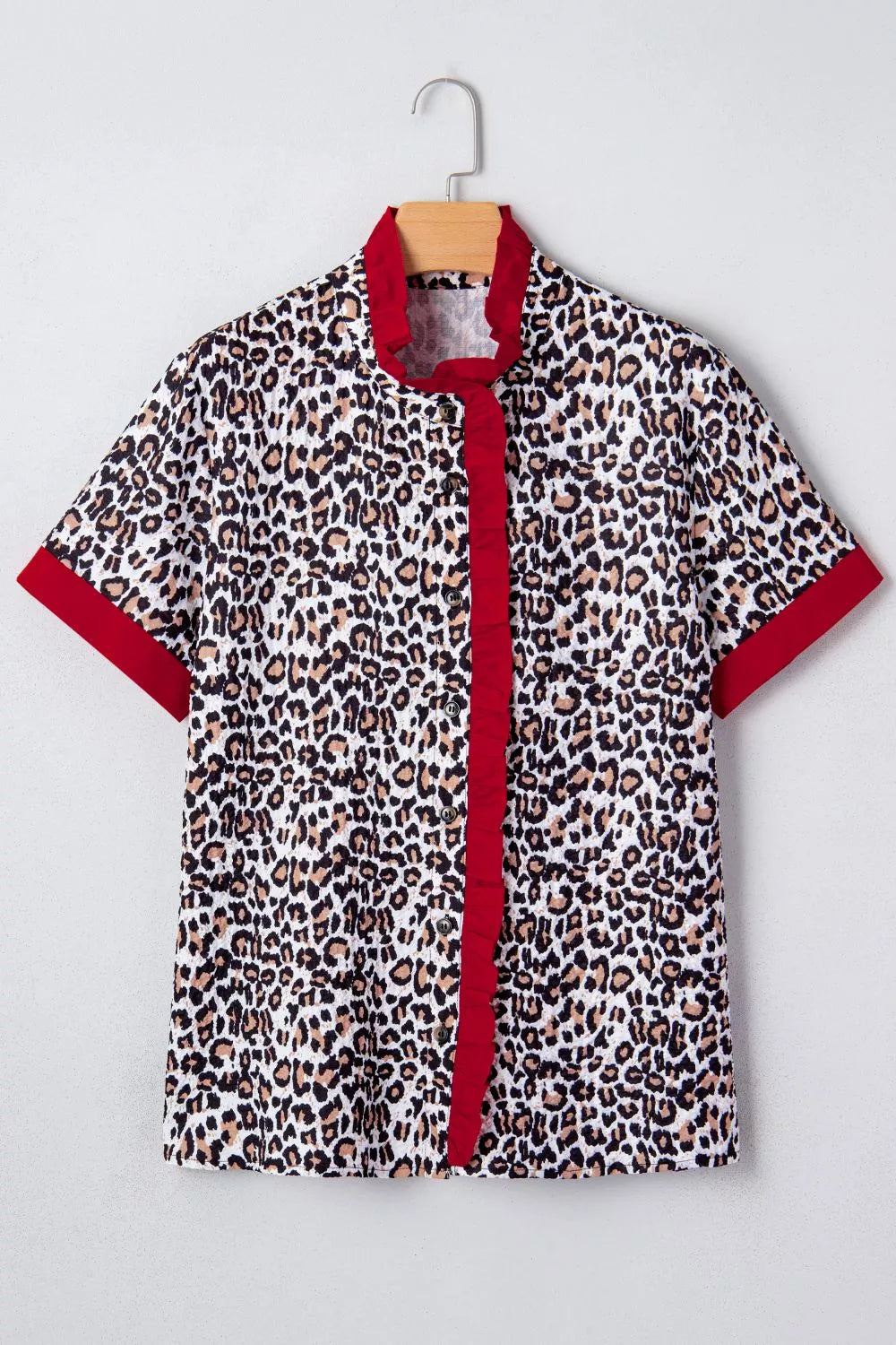 Leopard print short sleeve button-down with contrast ruffle trim