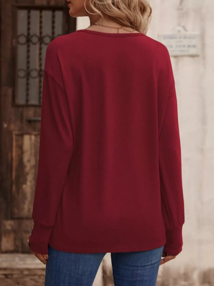 V-neck long sleeve top with button cuffs
