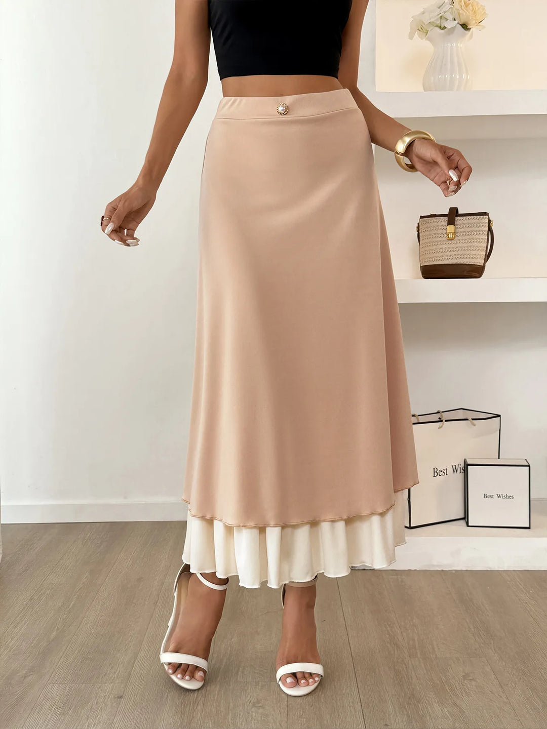 Layered A-line midi skirt with contrast ruffle hem