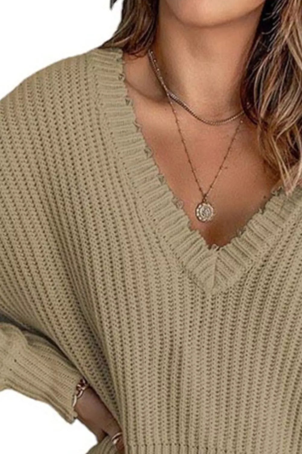 Distressed raw hem ribbed knit V-neck sweater