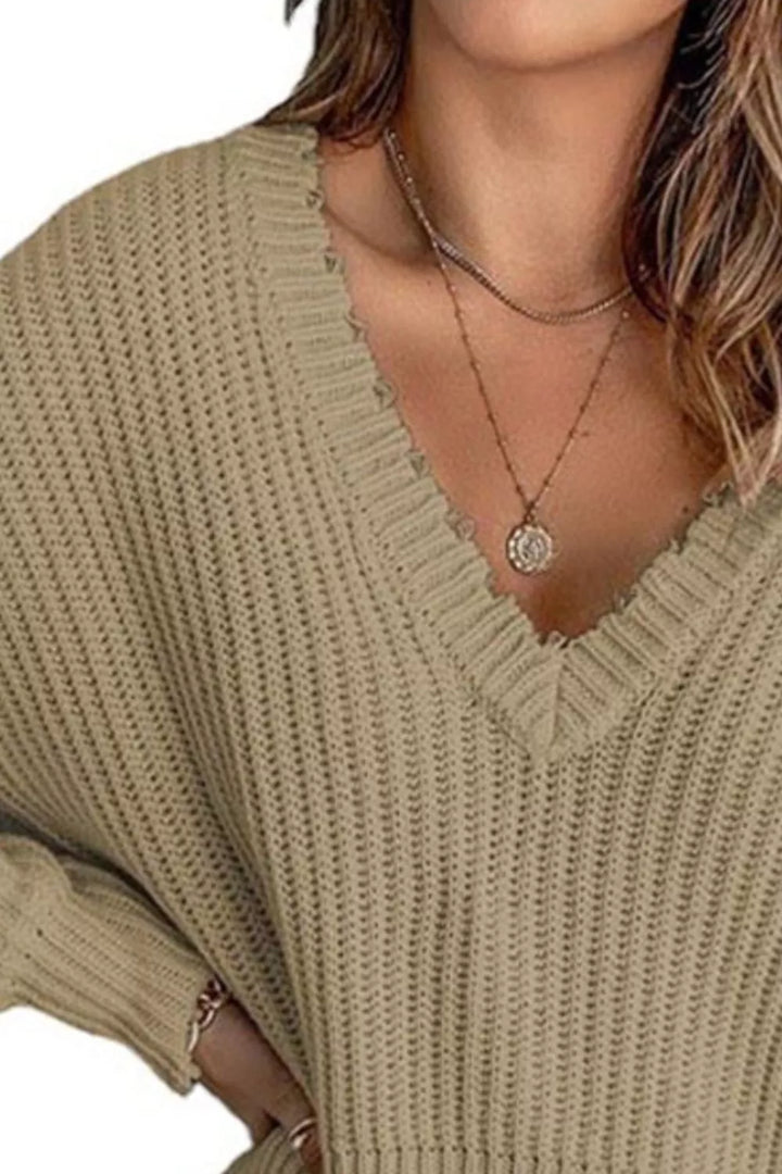Distressed raw hem ribbed knit V-neck sweater