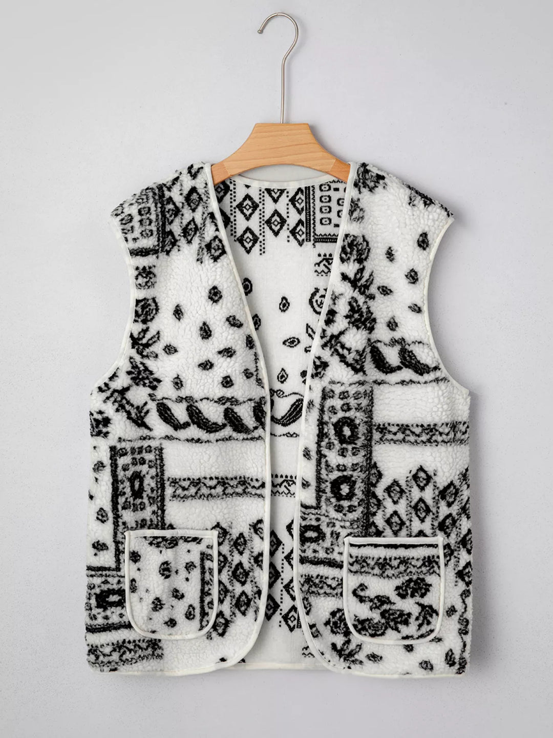 Open-front sherpa vest with paisley print and patch pockets