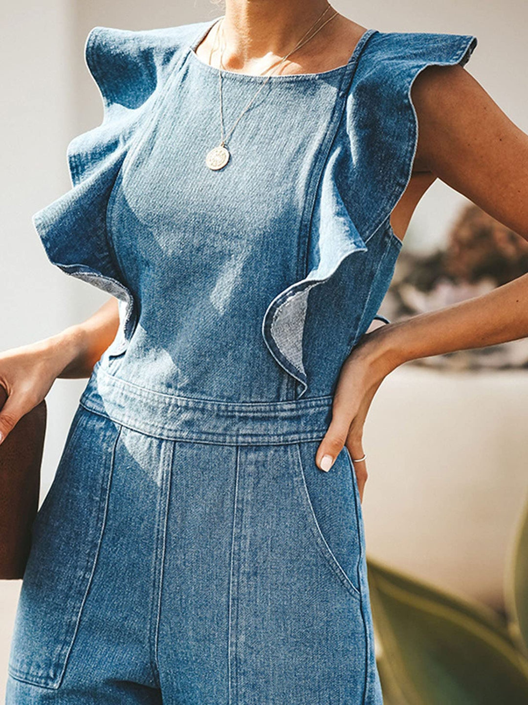 Ruffled sleeveless wide-leg denim jumpsuit