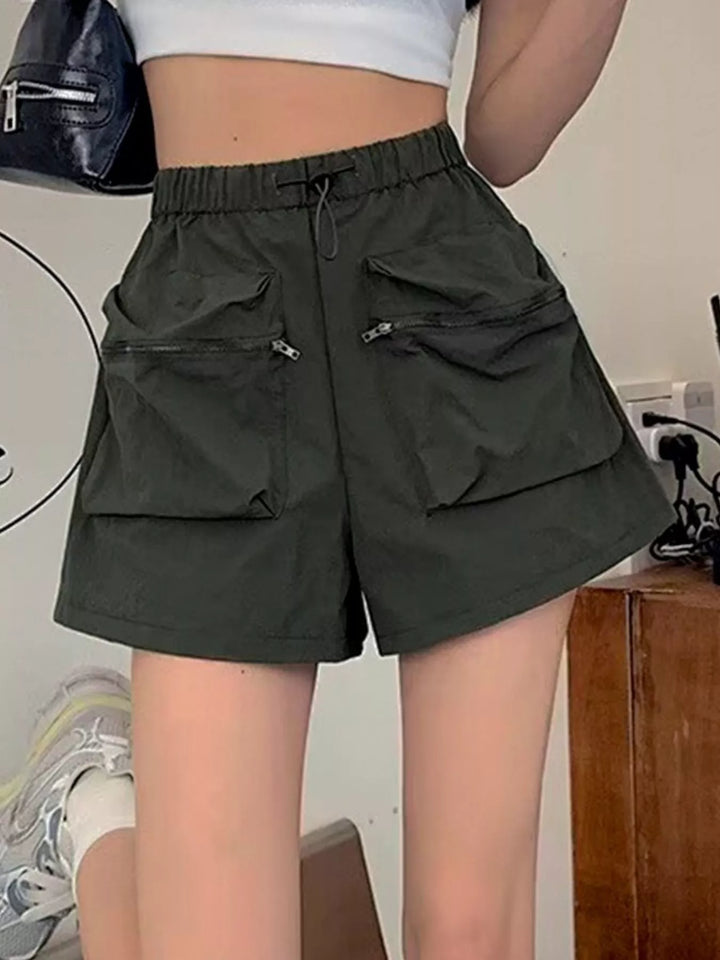 High-rise cargo shorts with zip pockets and drawstring waist