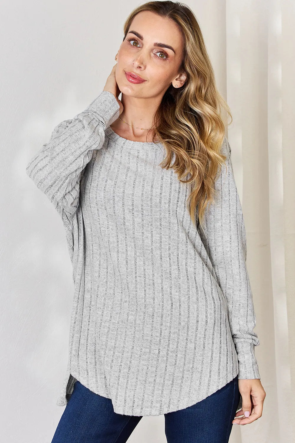 Ribbed knit round neck long sleeve top with side slits