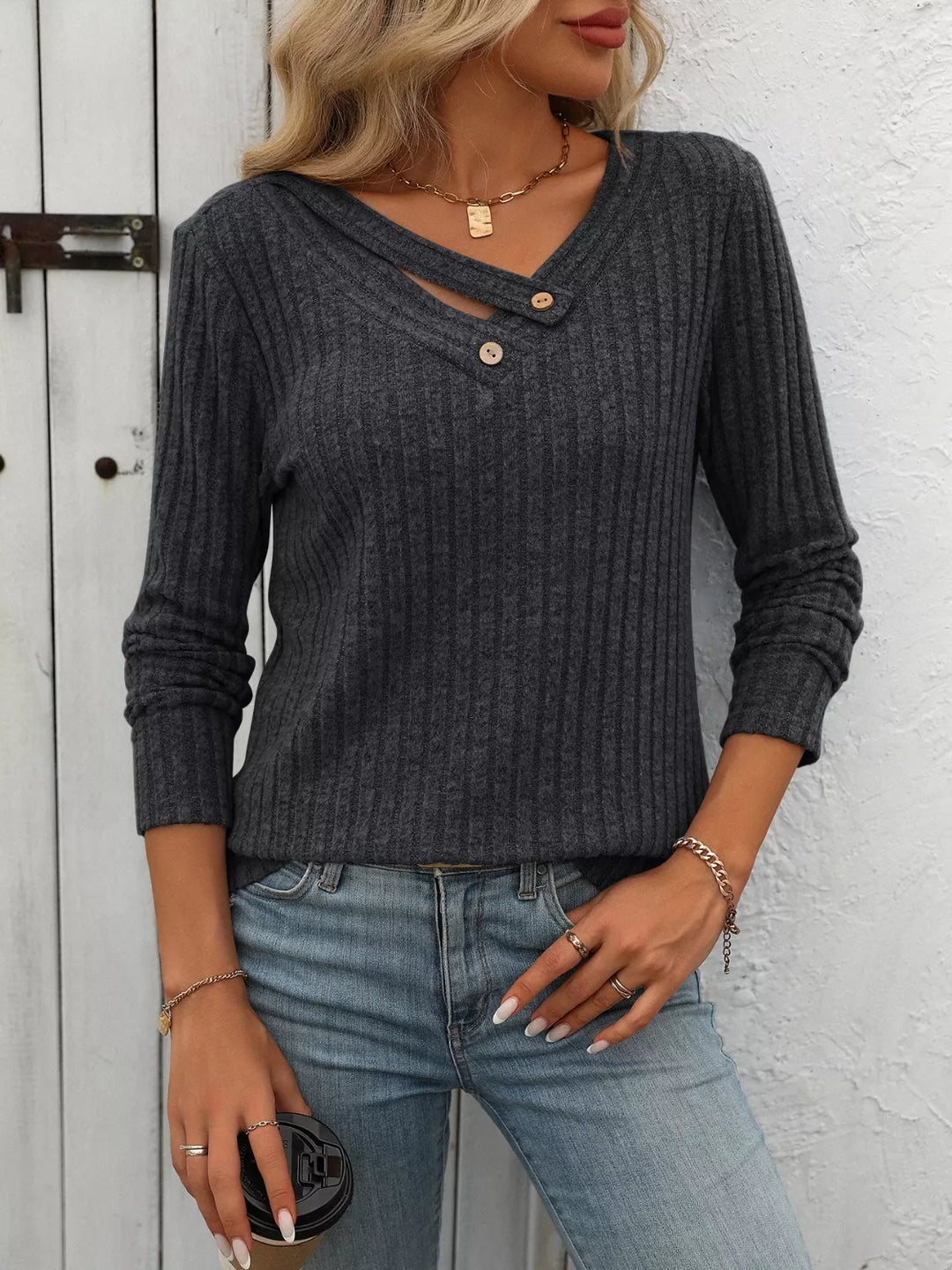 Ribbed knit long sleeve top with asymmetric button neckline
