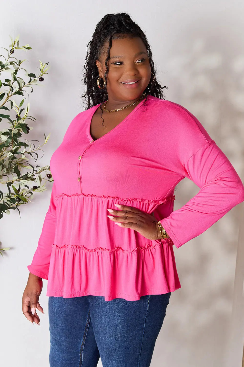 Half-button long sleeve blouse with tiered ruffle hem
