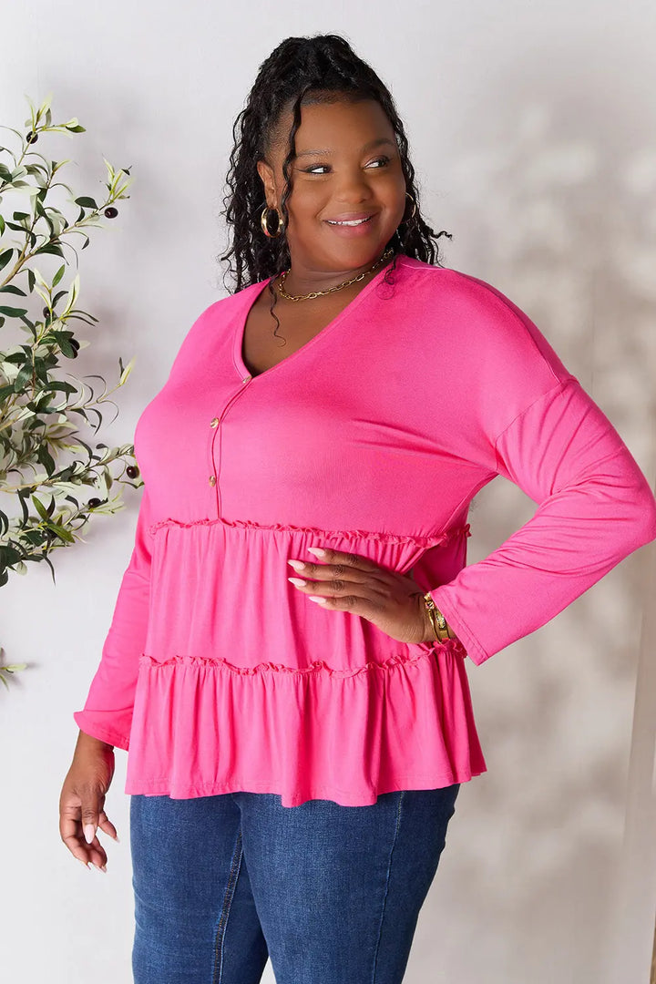 Half-button long sleeve blouse with tiered ruffle hem