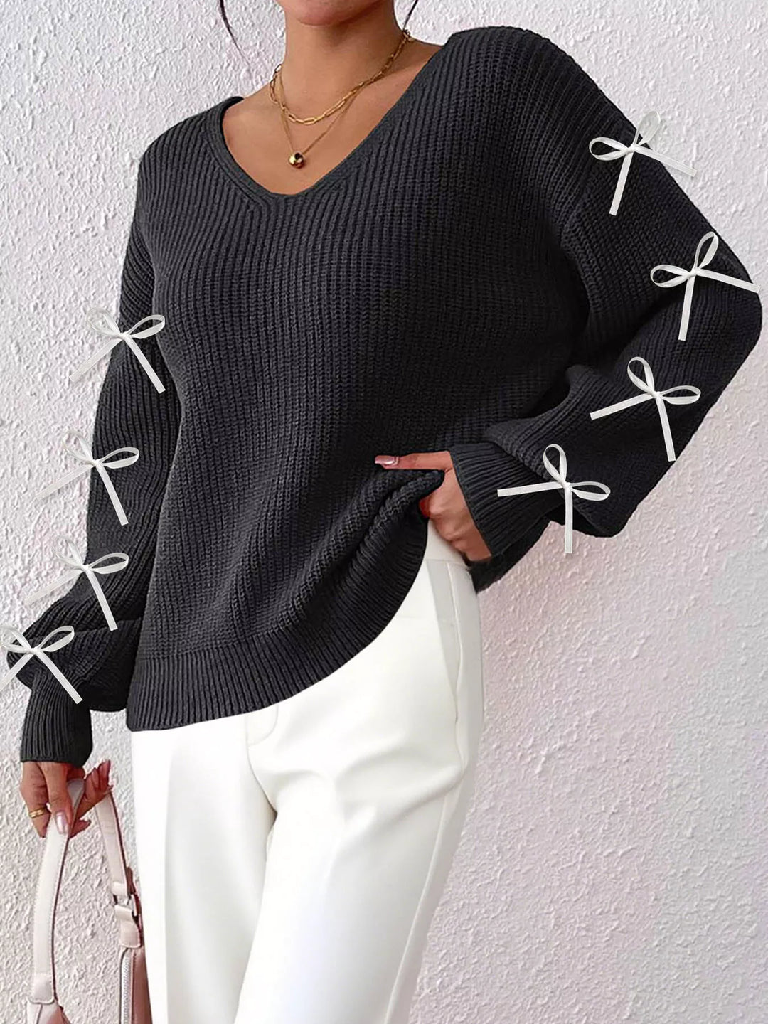 Ribbed knit V-neck sweater with bow-tie sleeves