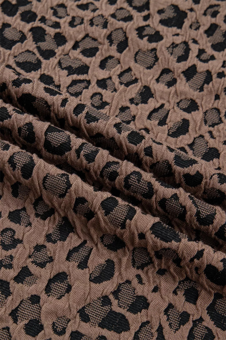 Leopard half-zip short sleeve top with striped collar and cuffs