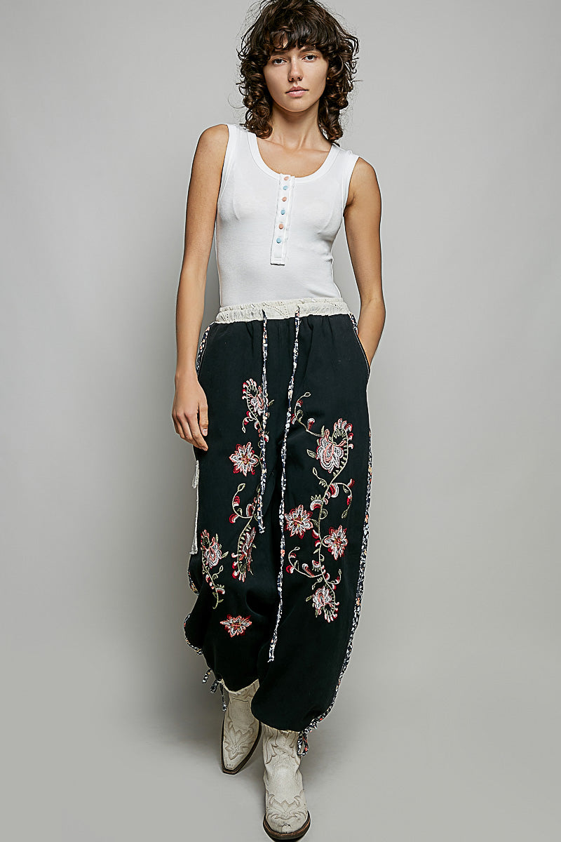 Ribbed knit tank with colorful buttons and raw-edge trim