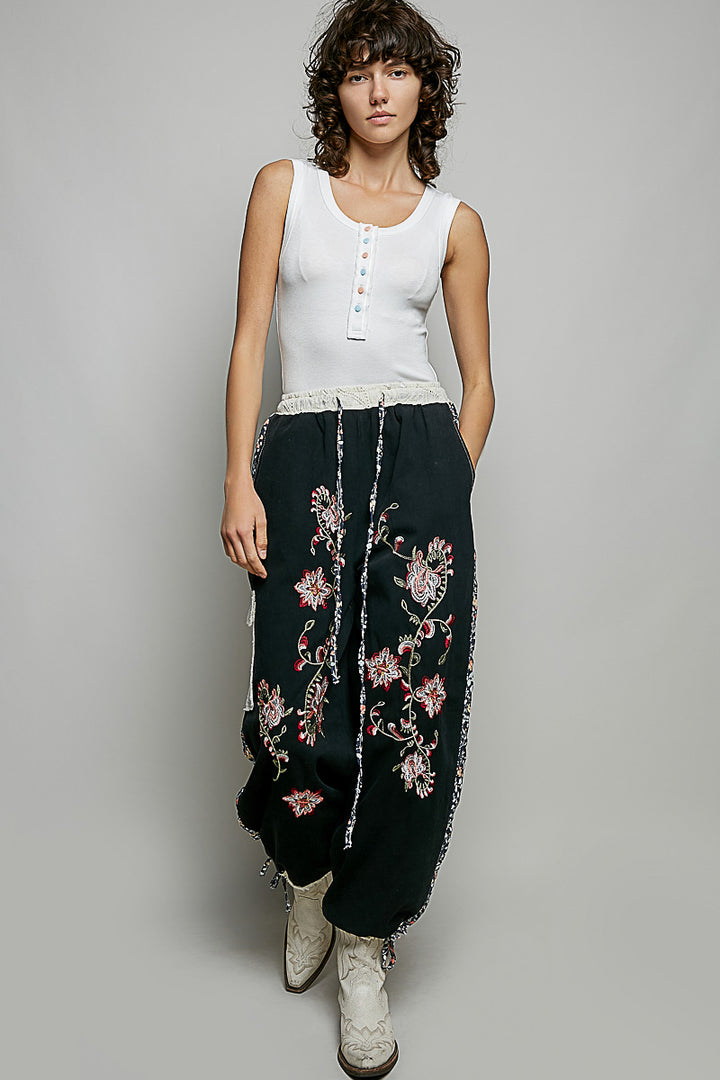 Ribbed knit tank with colorful buttons and raw-edge trim