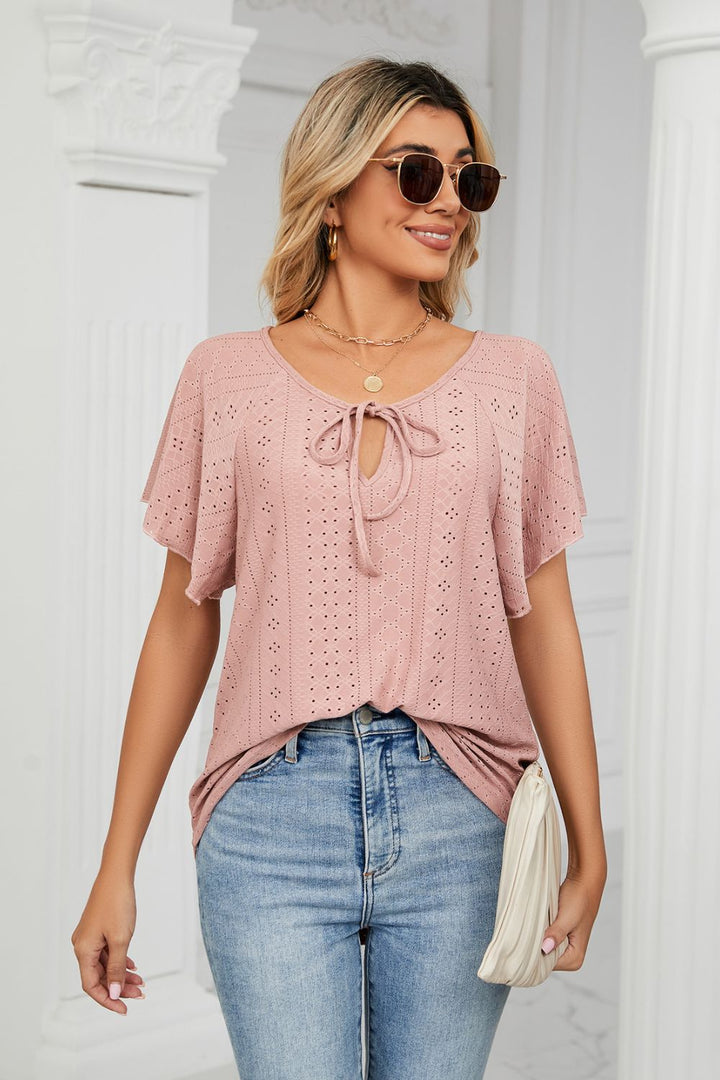 Eyelet flutter sleeve top with V-neck tie