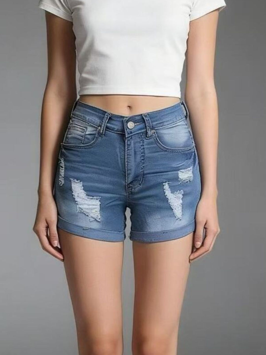 Distressed mid-rise denim shorts with cuffed hem