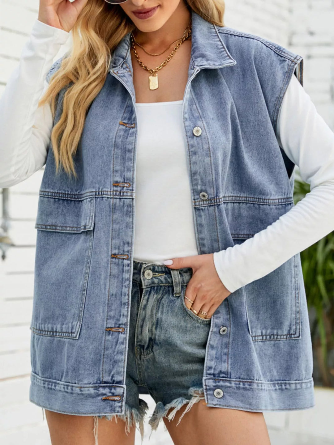 Light Blue Sleeveless button-down denim vest jacket with patch pockets