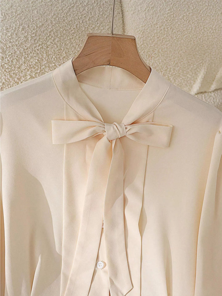 Puff sleeve bow-tie neck button-front blouse
