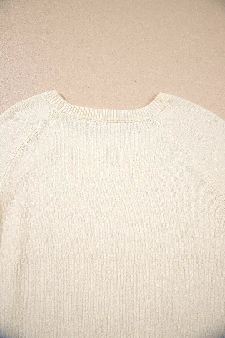 Button-cuff raglan sleeve crew neck sweater