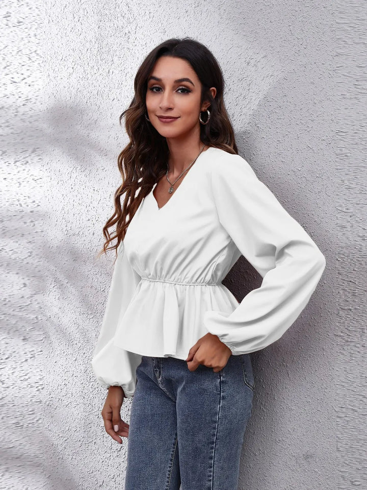 Balloon sleeve peplum blouse with V-neck