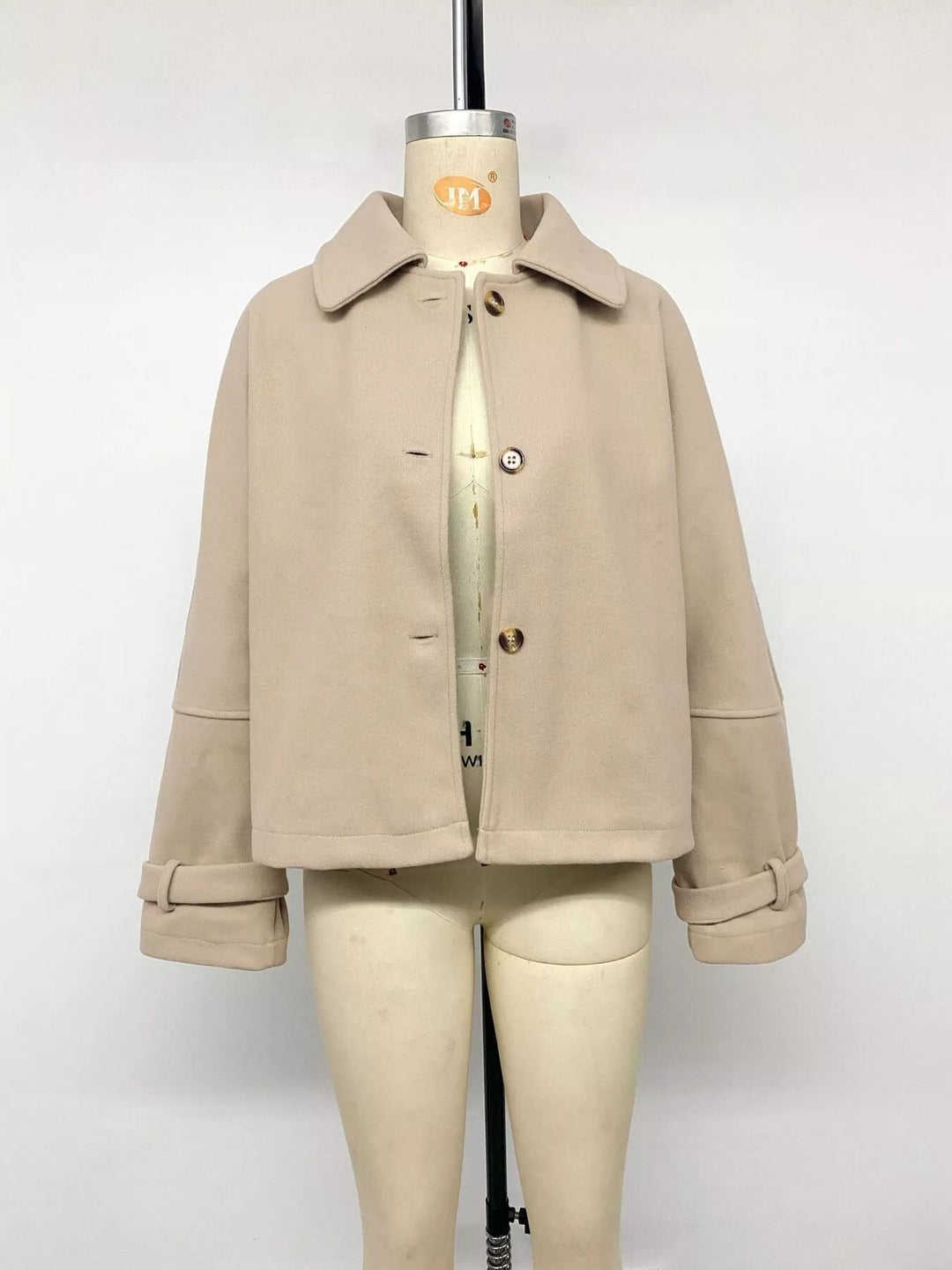 Cropped collared button-up jacket with cuff tabs