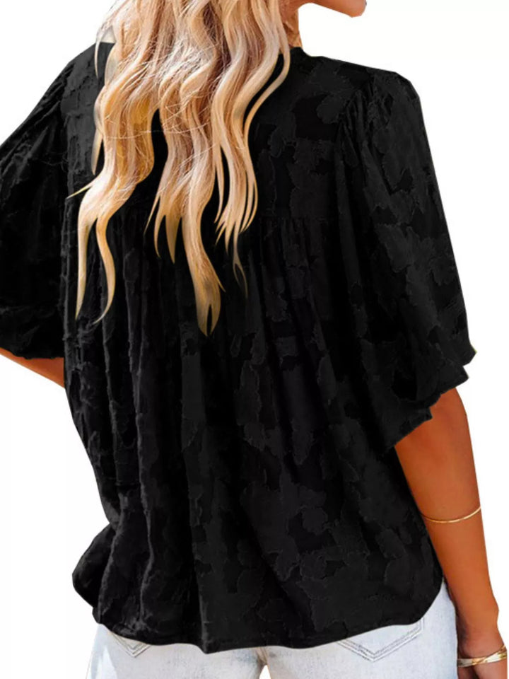 Textured V-neck ruffle-trim button-down blouse