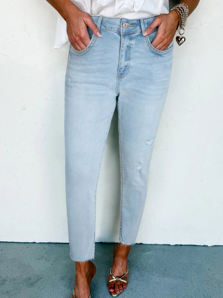 Light Blue Distressed mid-rise ankle skinny jeans with raw hem