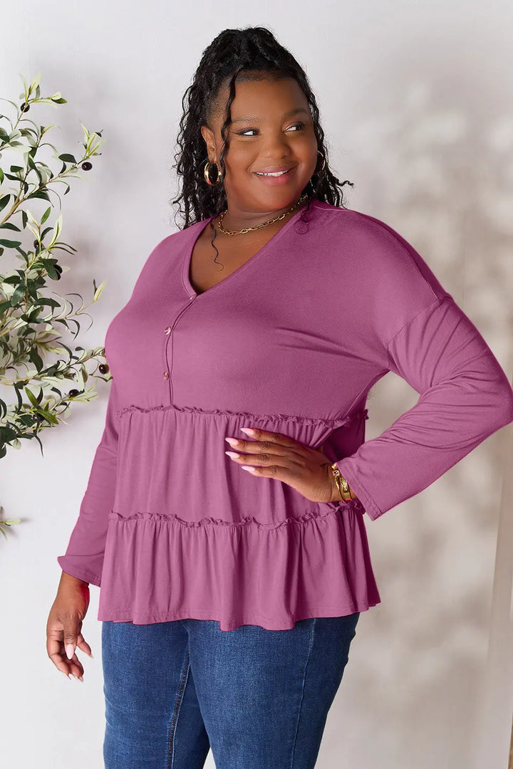 Half-button long sleeve blouse with tiered ruffle hem