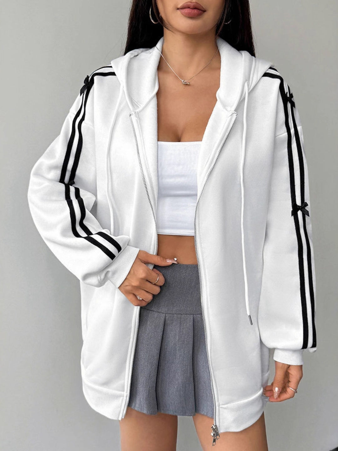 Zip-up hoodie with striped sleeves and bow detail