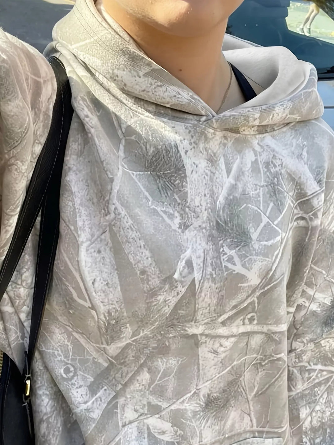 Oversized forest camo pullover hoodie with kangaroo pocket