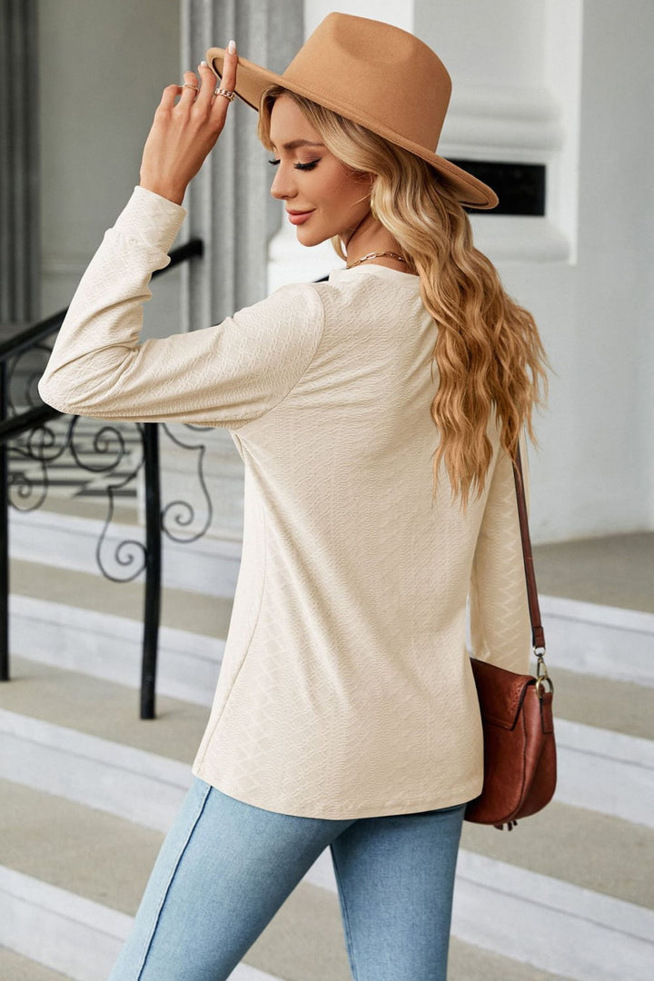 Textured knit long sleeve top with button placket