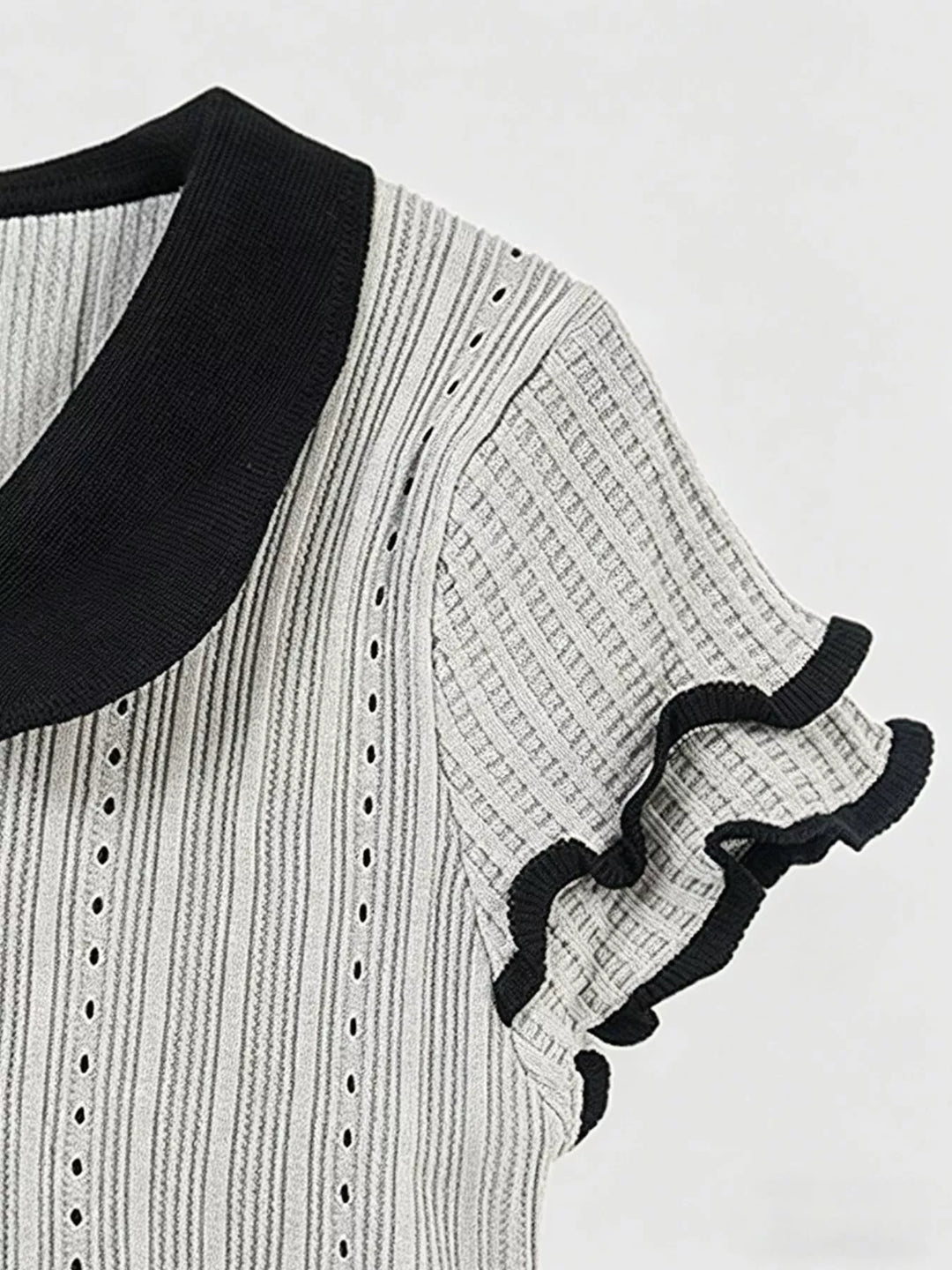 Ribbed knit crop top with Peter Pan collar and ruffle sleeves