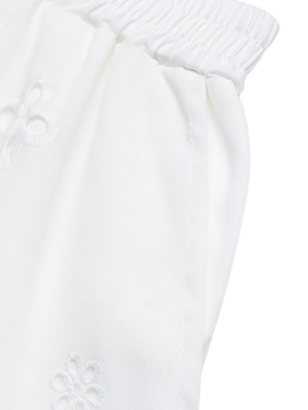 Eyelet embroidered shorts with lace-trim hem and pockets