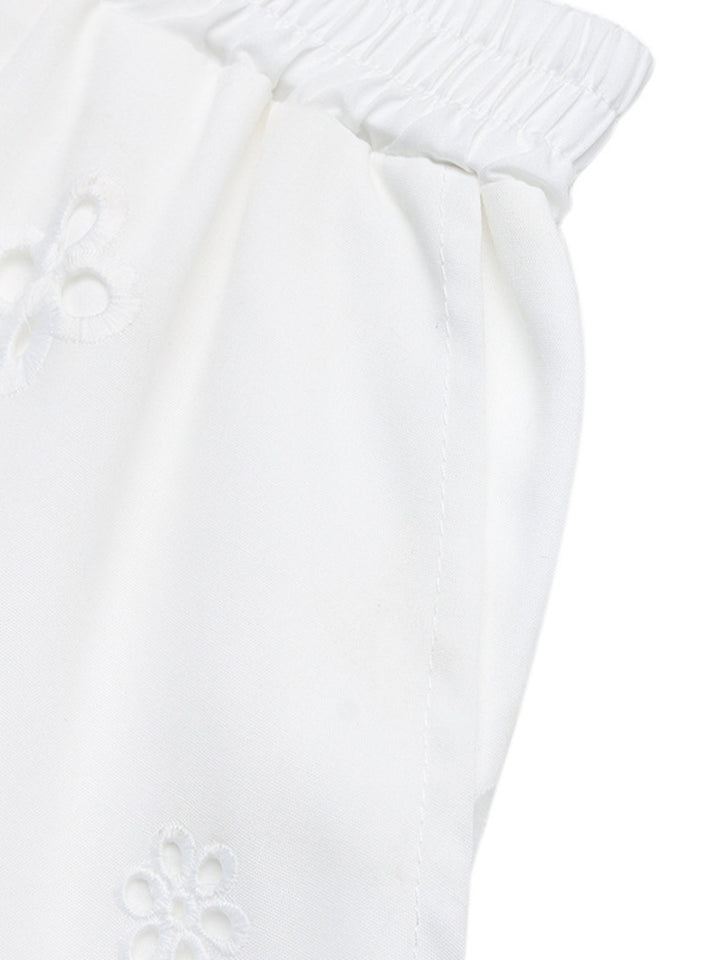 Eyelet embroidered shorts with lace-trim hem and pockets