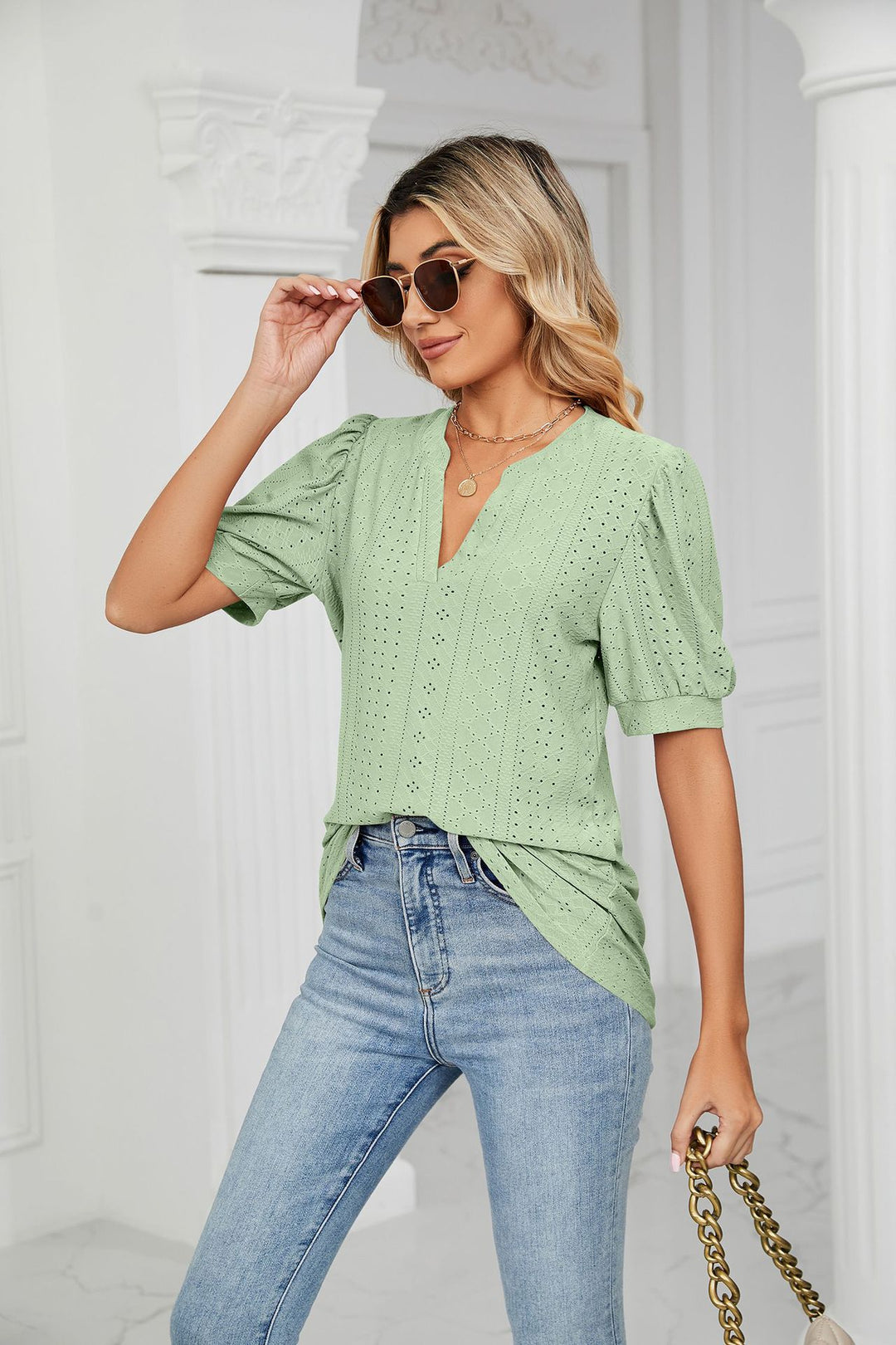 Eyelet puff sleeve top with notched V-neck