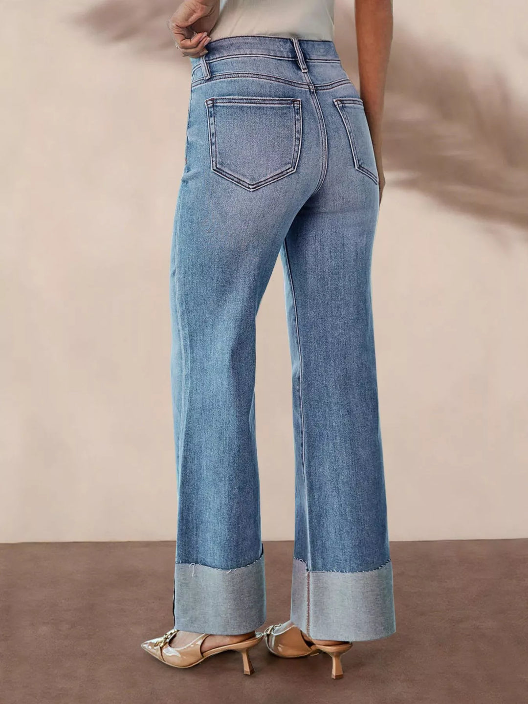 Distressed high-rise flare jeans with raw cuffed hem