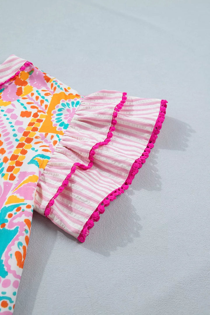 Patchwork mixed print blouse with ruffle sleeves and pom-pom trim