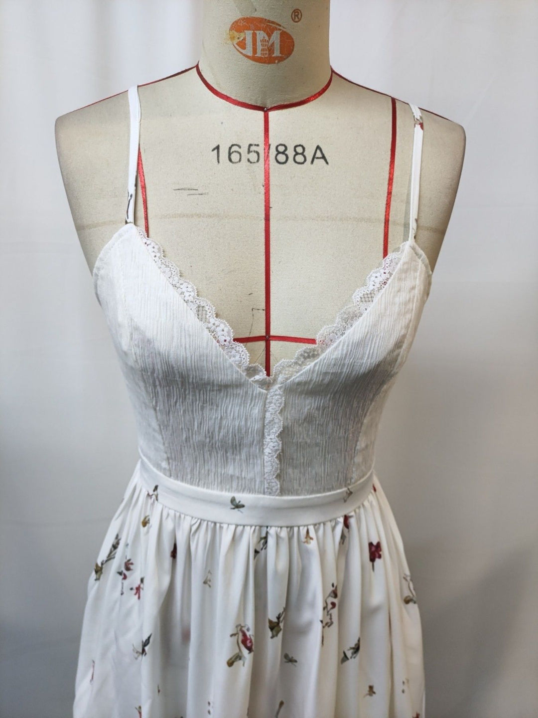 Floral cami dress with lace trim and asymmetrical hem